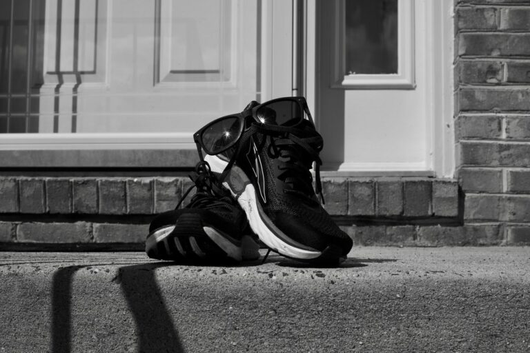 Running shoes left by the front door as a cue, ready for a habit that actually sticks
