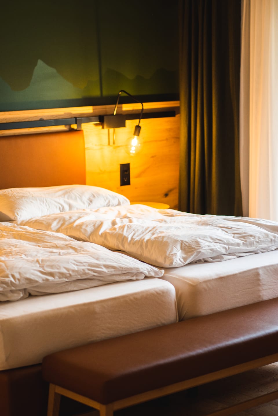 A cozy, warmly-lit bedroom, illustrating quality sleep environment